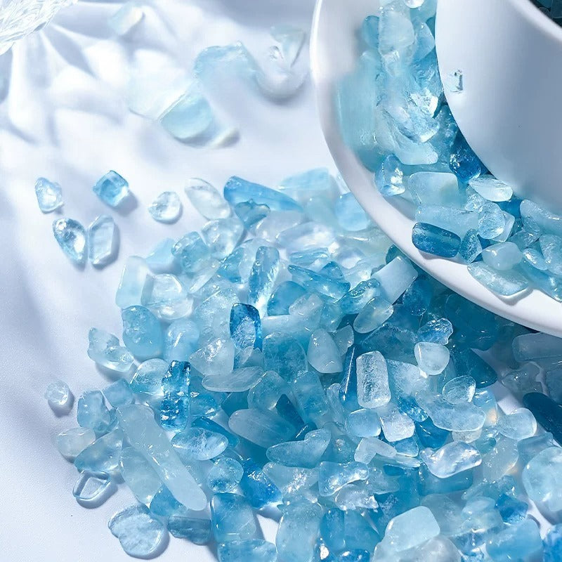 Natural aquamarine tumbled crystal chips available in 50g 100g 500g and 1000g packs