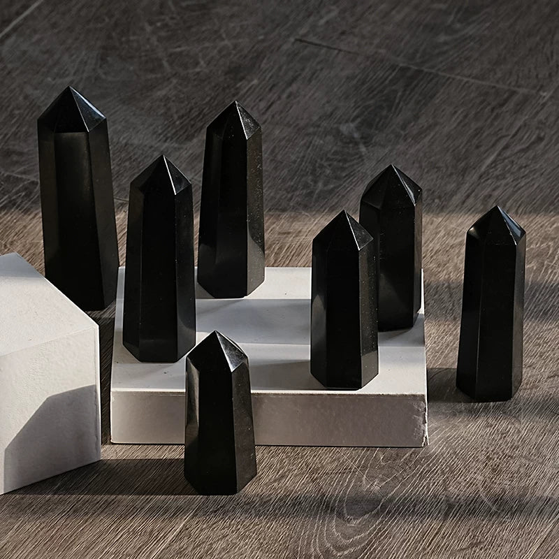 Black tourmaline crystal tower with natural mineral texture for grounding and cleansing