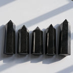 Polished black tourmaline tower natural schorl crystal with white mineral inclusions