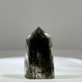 Green phantom quartz single point tower with grey green inclusions for meditation and home decor