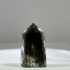Green phantom quartz single point tower with grey green inclusions for meditation and home decor